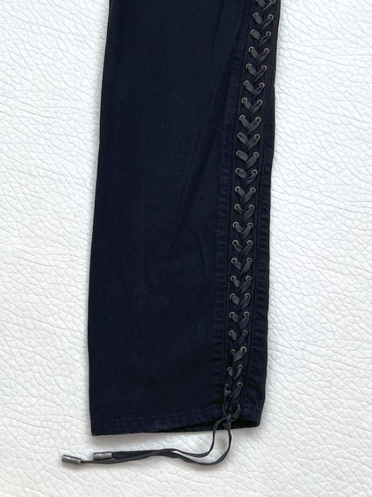 Alexander McQueen black jean with adjustable straps on the sides