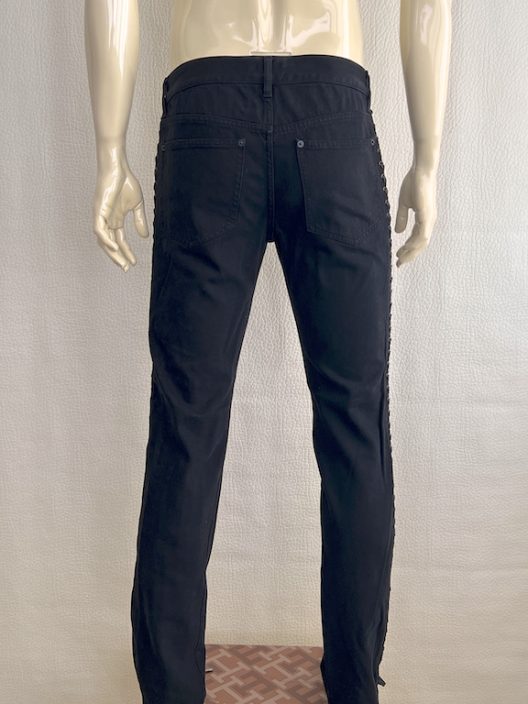 Alexander McQueen black jean with adjustable straps on the sides